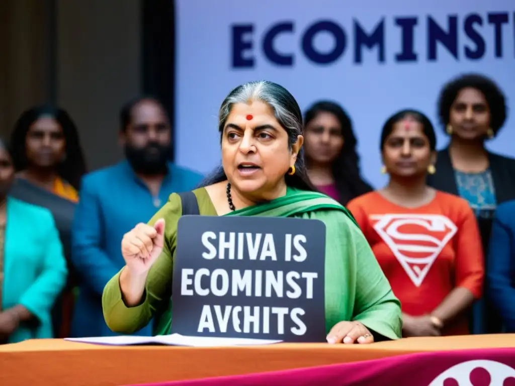 Vandana Shiva habla apasionadamente en un podio rodeada de activistas ecofeministas, transmitiendo la energía y la unidad del movimiento